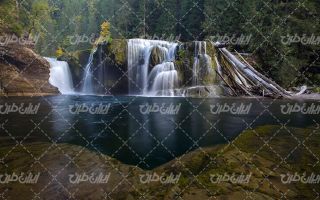 تصویر با کیفیت آبشار زیبا به همراه درختان سوزنی و رودخانه