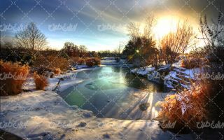 تصویر با کیفیت غروب زیبای خورشید به همراه برف و طبیعت برفی