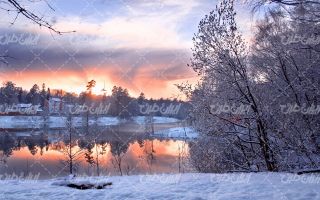 تصویر با کیفیت چشم انداز زیبای غروب آفتاب به همراه برف و منظره برفی