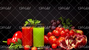 تصویر با کیفیت آب میوه طبیعی همراه با آبمیوه و میوه