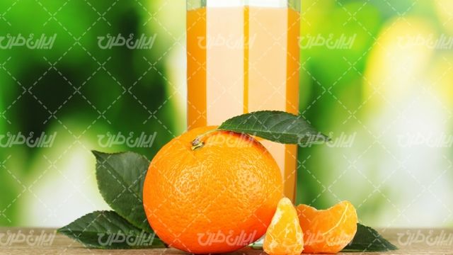 تصویر با کیفیت پرتقال همراه با میوه و آب میوه