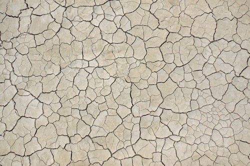 پس زمینه زمین خشک ترک خرده 
