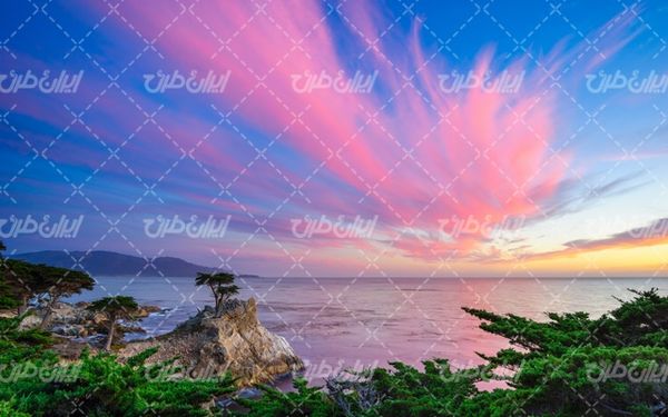 تصویر با کیفیت منظره زیبای غروب خورشید همراه با دریا ساحل