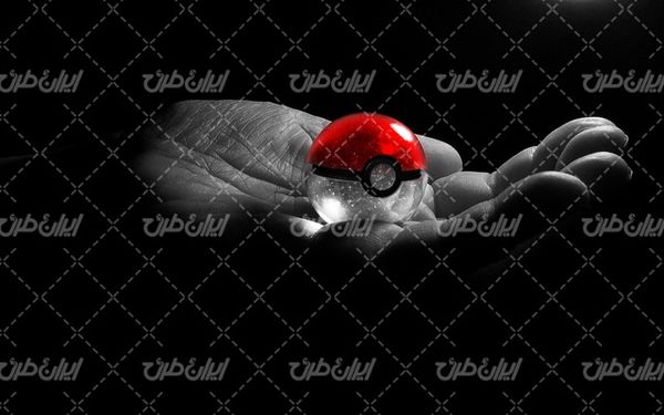 تصویر با کیفیت دست به همراه گوی رنگی و پس زمینه تیره