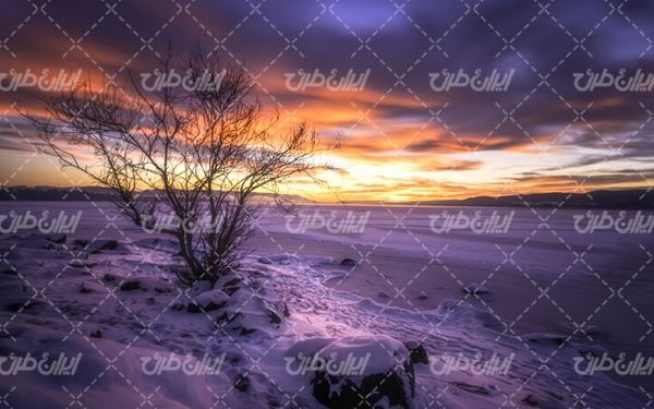 تصویر با کیفیت غروب ریبای خورشید به همراه برف و طبیعت برفی