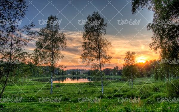 تصویر با کیفیت چشم انداز زیبای غروب آفتاب همراه با منظره و طبیعت زیبا