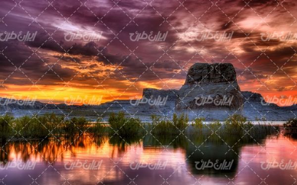تصویر با کیفیت چشم انداز زیبای غروب  آفتاب همراه با منظره دیدینی و طبیعت زیبا
