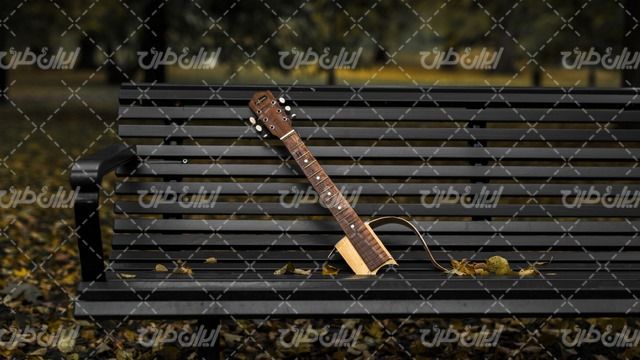 تصویر با کیفیت آلات موسیقی همراه با نیمکت چوبی و گیتار